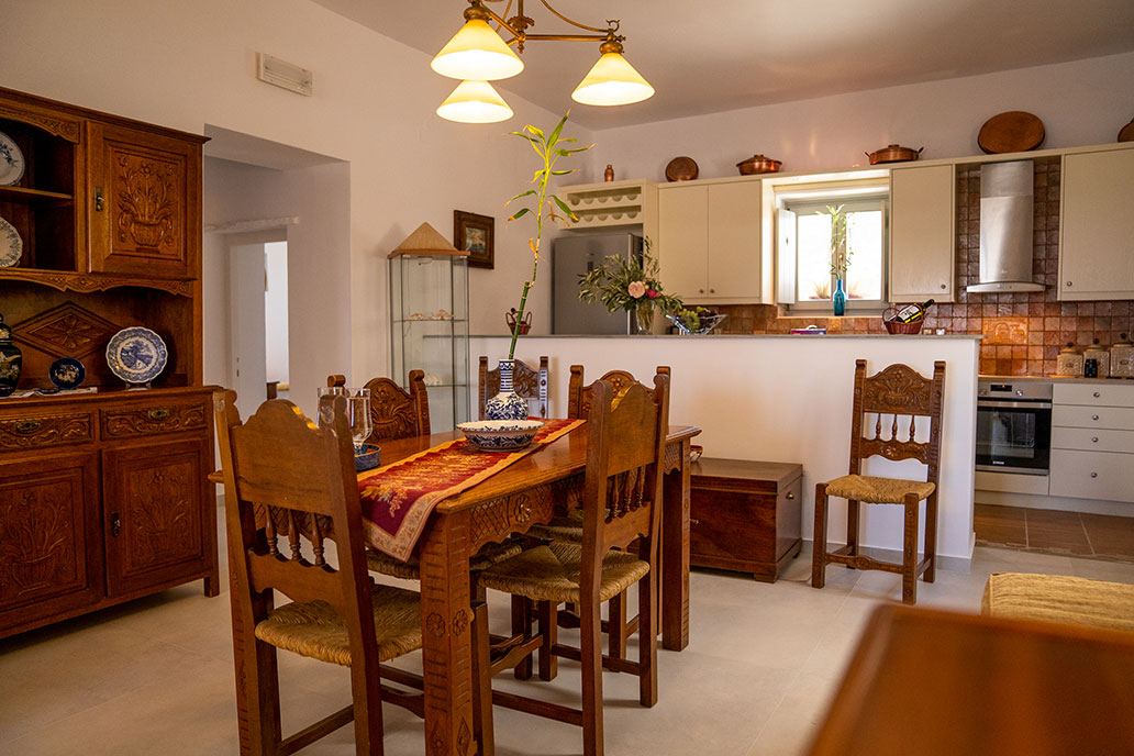 The kitchen and the dinning table of Pelagos Residence in Sifnos