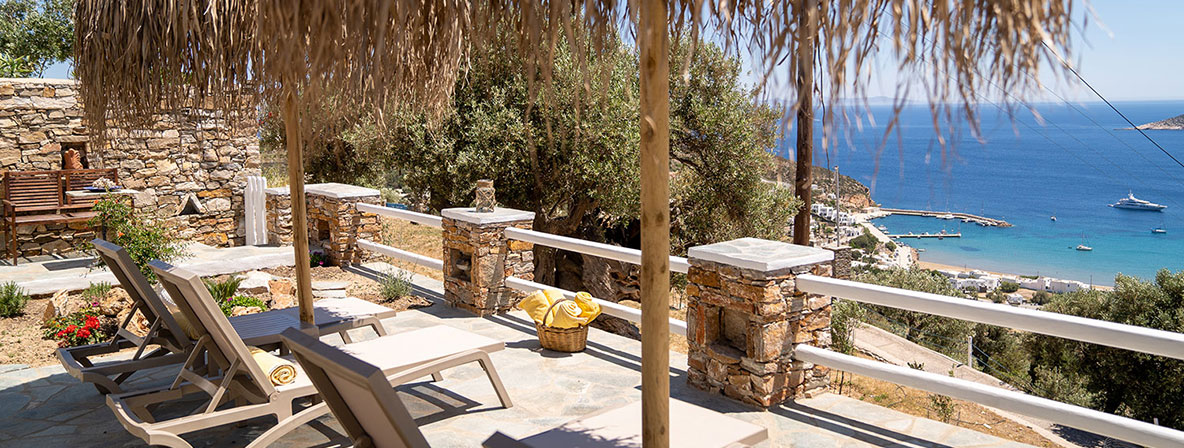 Veranda with sunbeds at Pelagos Residence