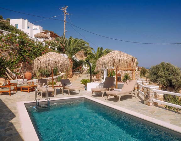 Veranda with sunbeds at Pelagos Residence